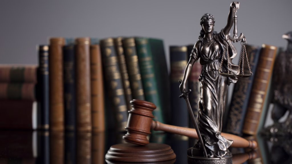 What Is Negligence Per Se in Nevada and How Does It Help Your Case? 1 A bronze Lady Justice statue holding scales, a judge's gavel, and a row of old legal books in the background. © Marathon Law Group